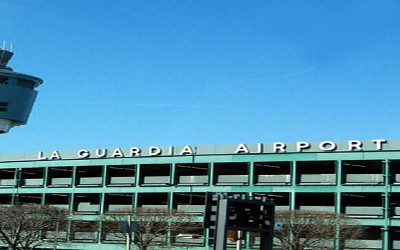 A large green building with the words guardia airport on it.