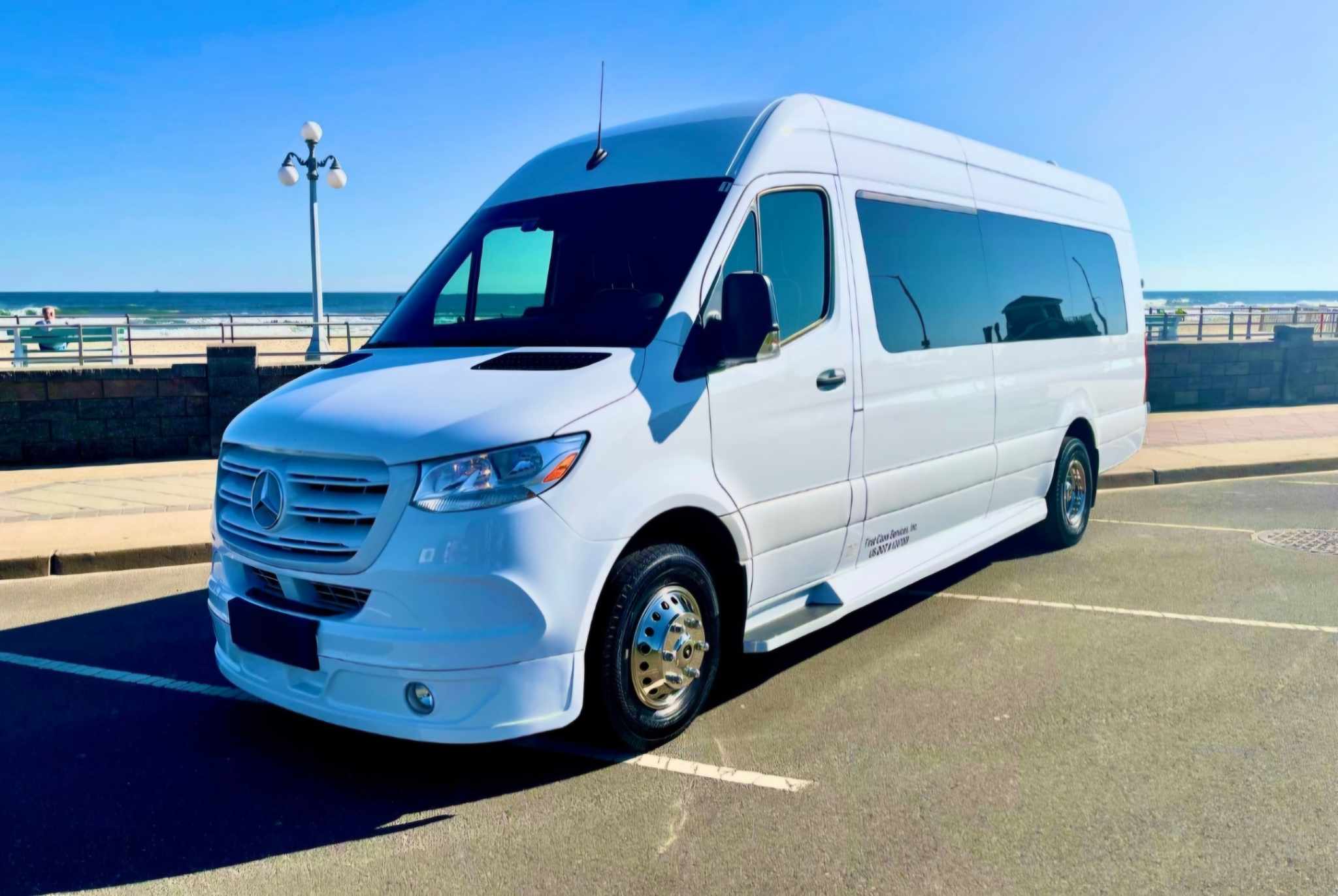 A white van parked in the parking lot.