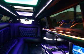 A limo is shown with its lights on.