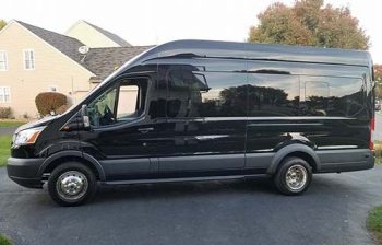 A black van is parked in the street.