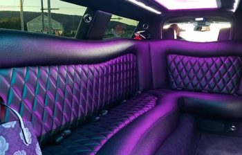 A purple car with a black leather seat