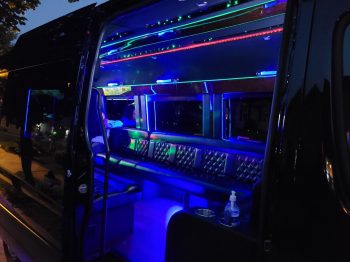 A view of the inside of a bus at night.