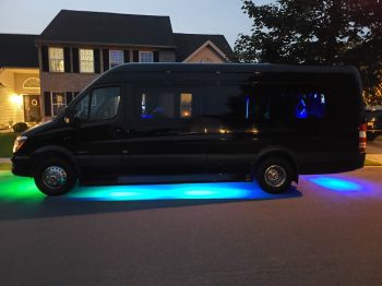 A van with blue lights on the side of it.